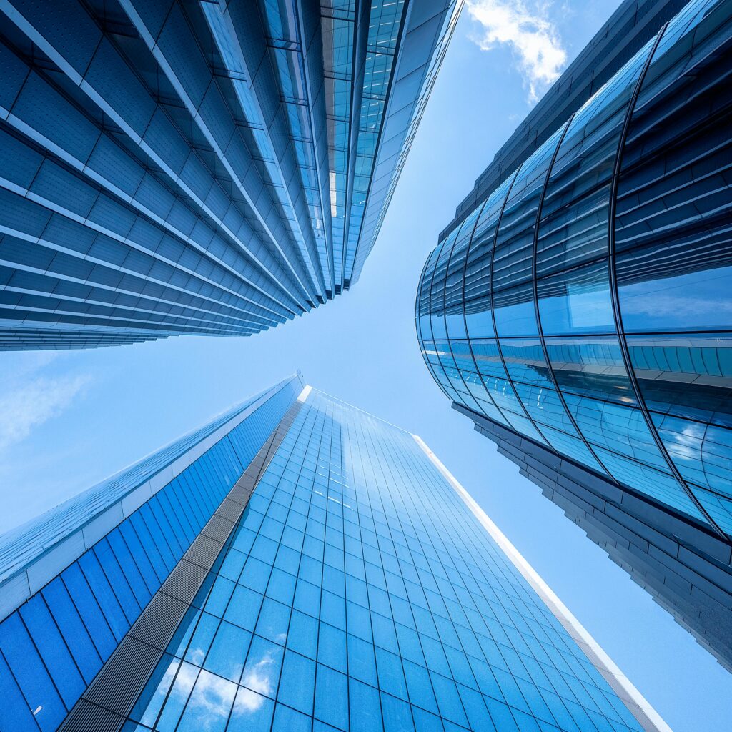 pexels-photo-19599880-19599880 Striking upward view of modern skyscrapers against a clear London sky, showcasing urban architectural elegance.